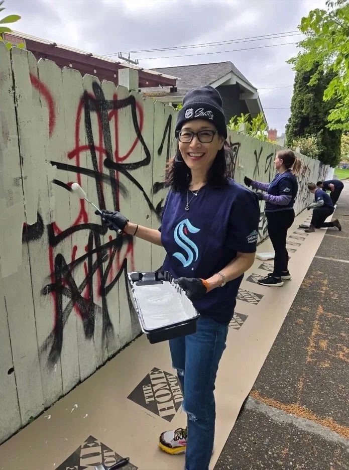 Mari helps out in the community. Photo credit: Seattle Kraken