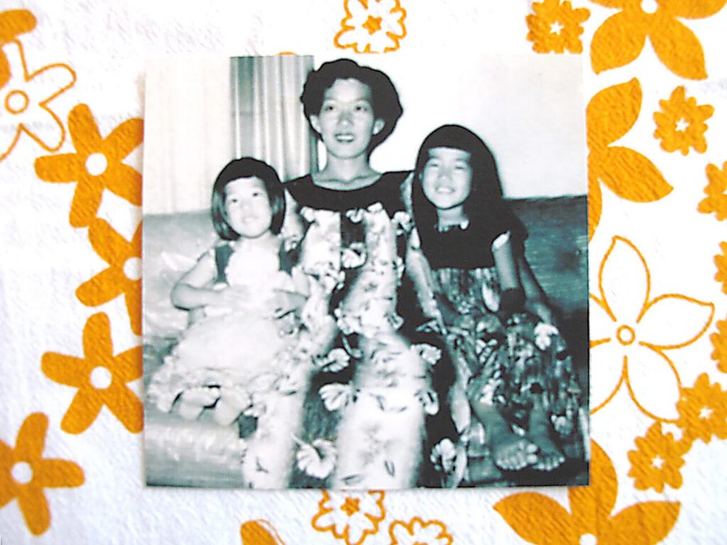Laurie, mom and Penny dressed in muumuu for May Day. -Lei Towel