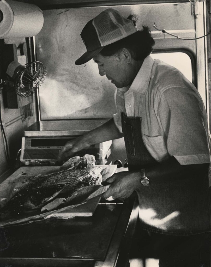 Ray Goto cleaning fish