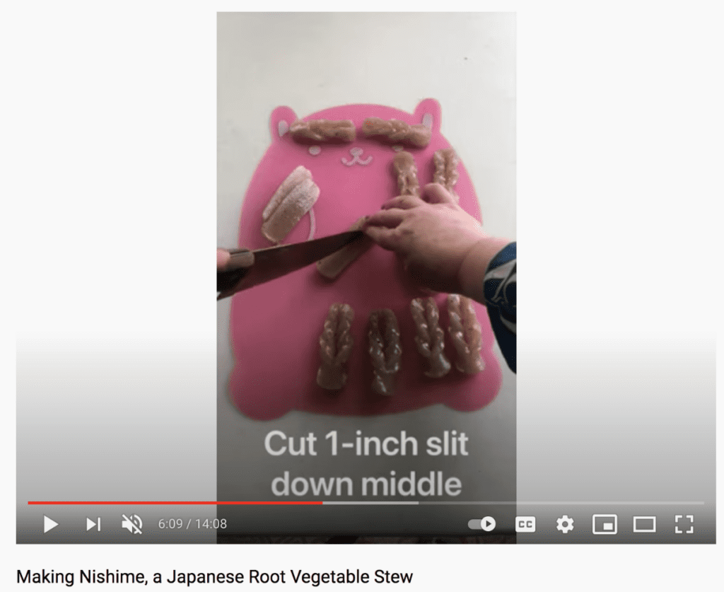 she expertly cuts a slit in the middle of konnyaku (konjac, a low-calorie yam) slices