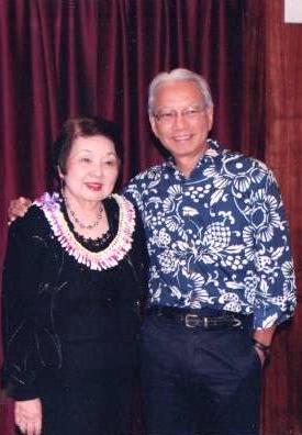 Muriel with Grant Kagimoto, designer and president of Cane Haul Road, known for its unique graphic designs of verbal and visual puns on local Hawaiʻi culture. Muriel and Grant served together on the board of the Mōʻiliʻili Community Center.