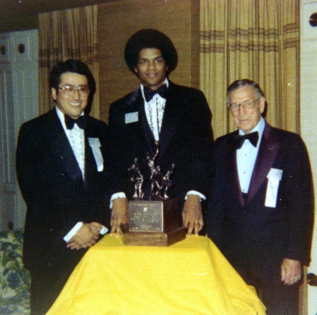 1977 - Presenting inaugural John R. Wooden Award to recipient Marques Johnson (UCLA). Tetsu started and still is on the Wooden Award Committee.